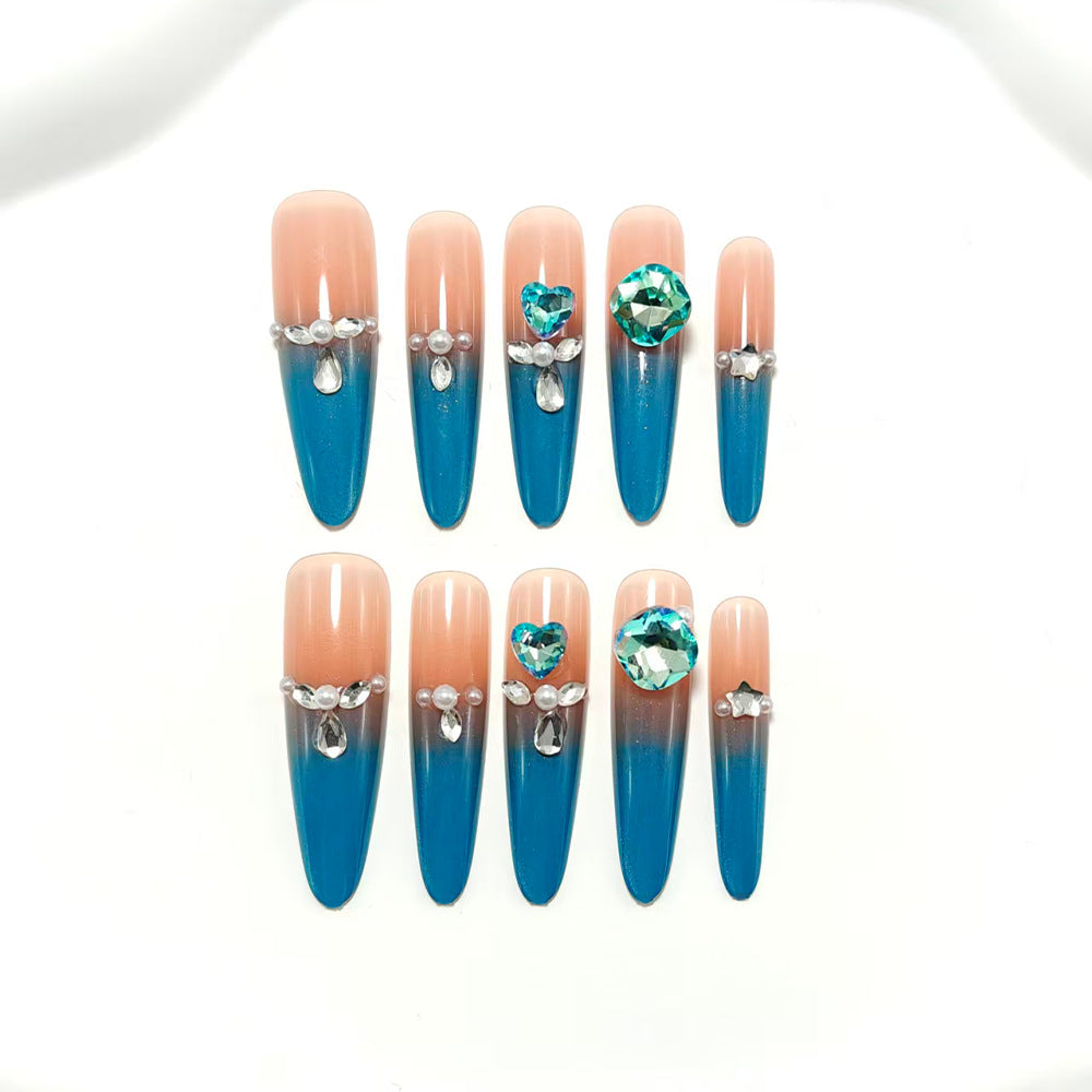 Artificial nails with glitter and rhinestone embellishments Stornfield