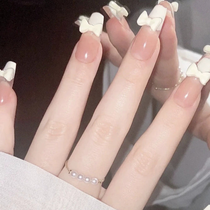 Elegant nail design with pearl embellishment Stornfield