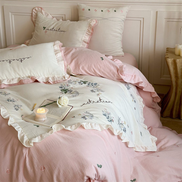 Bedding set with ruffles, embroidered middle cover and delicate flower application