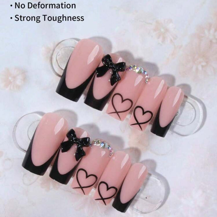 Acrylic nail set with elegant heart and bow design Stornfield
