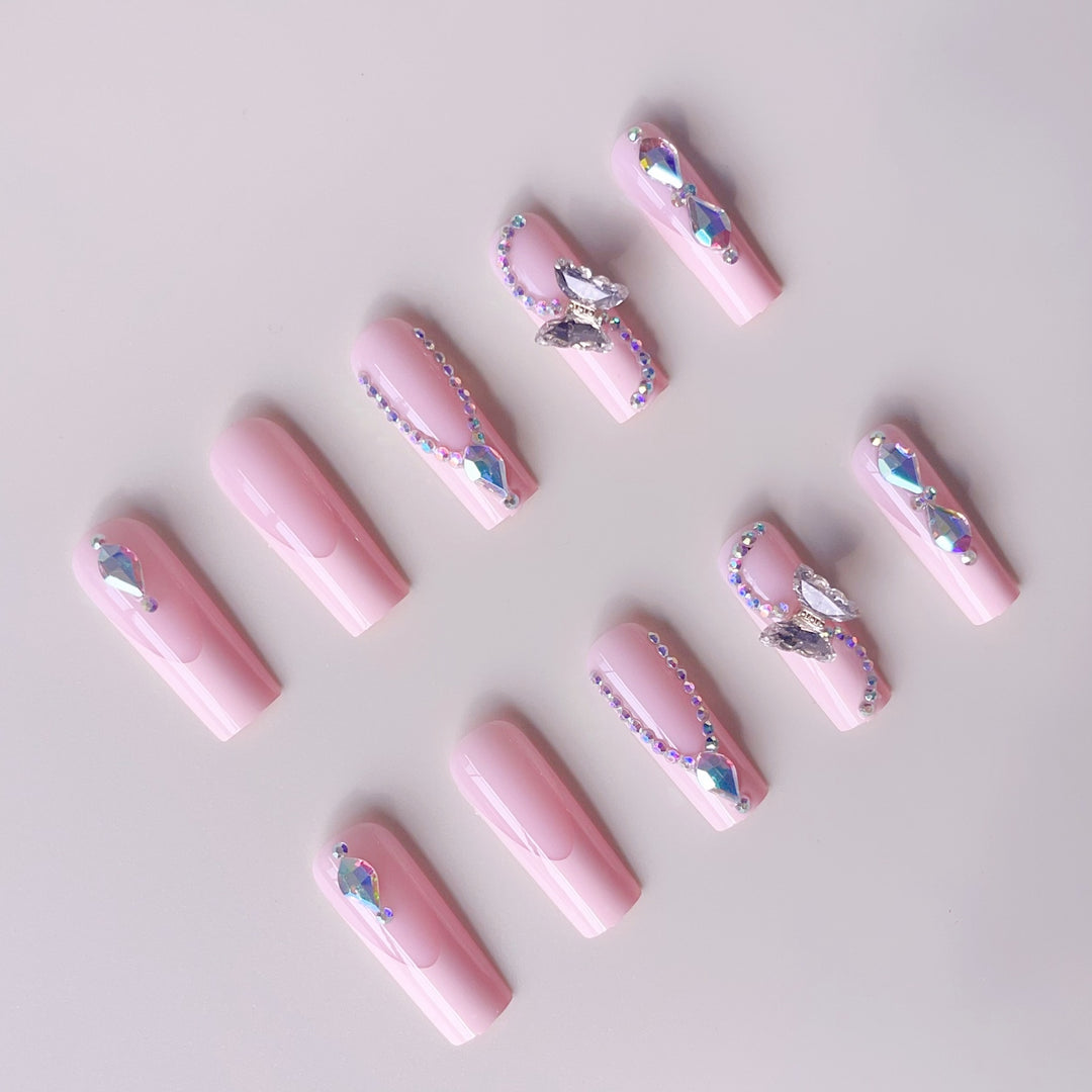 Acrylic nail set with elegant glitter and rhinestone accents Stornfield