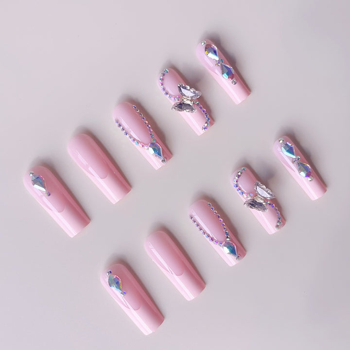 Acrylic nail set with elegant glitter and rhinestone accents Stornfield