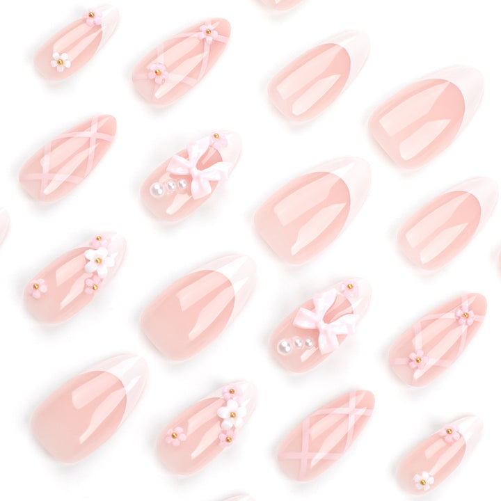 Artful nail art with delicate bows and floral accents Stornfield