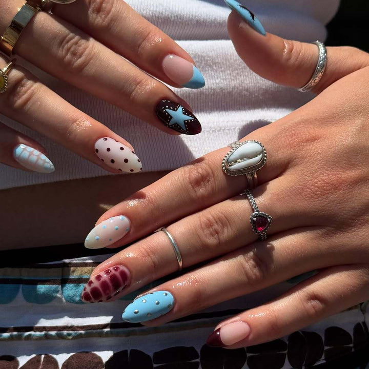 Artificial nail set with creative patterns and playful accents Stornfield