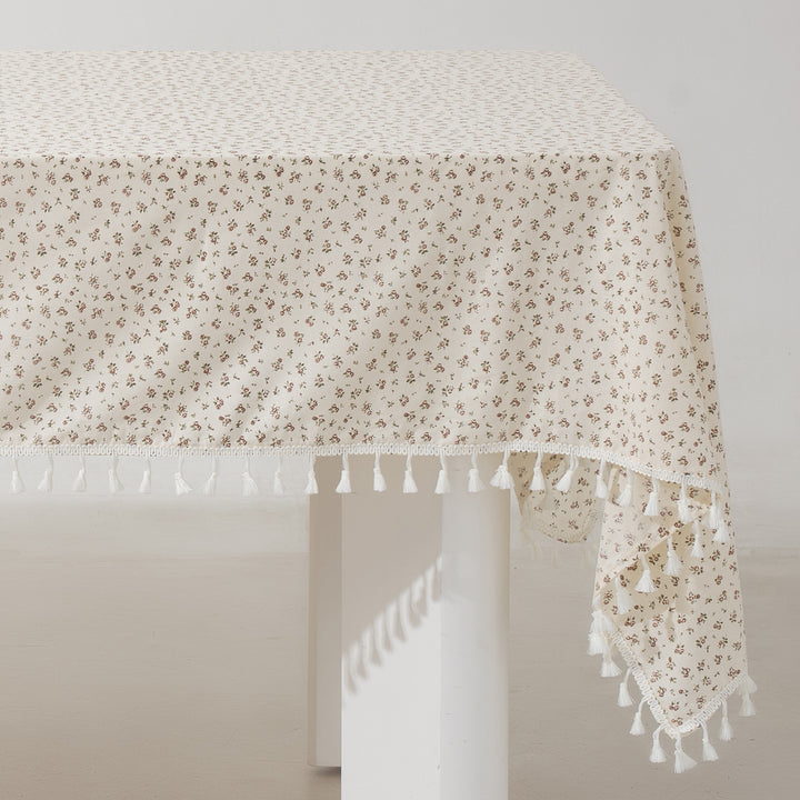 Rectangular tablecloth made of cotton-linen blend with delicate floral print and tassels