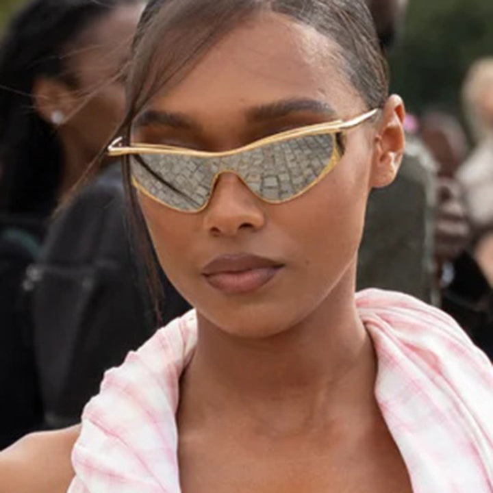 Ladies extravagant shaped sunglasses with protective UV filter Stornfield