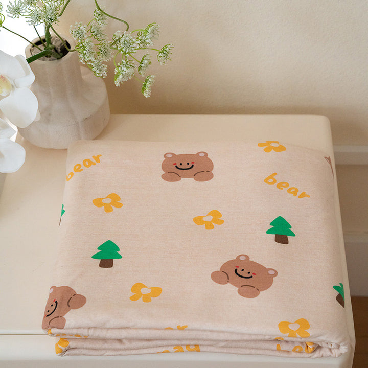 Organic Cotton Muslin Swaddle Blanket with Playful Cartoon Print