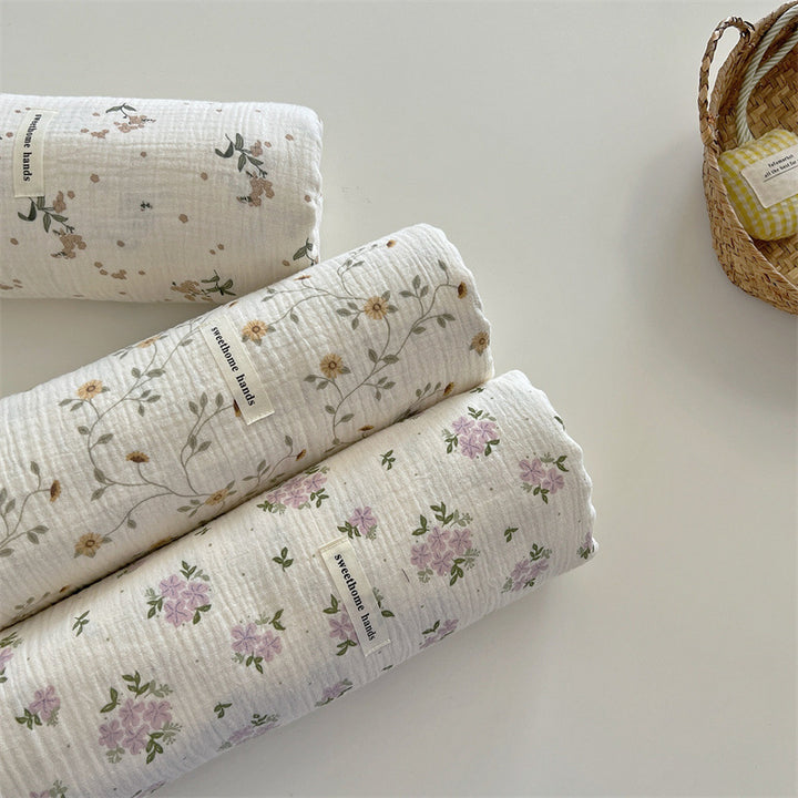 Unisex versatile muslin blanket with floral accents Stornfield