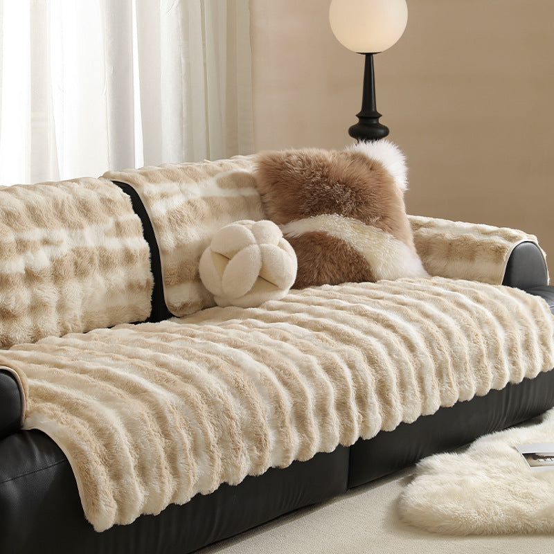 Luxurious sofa cover made of faux fur with ribbed texture