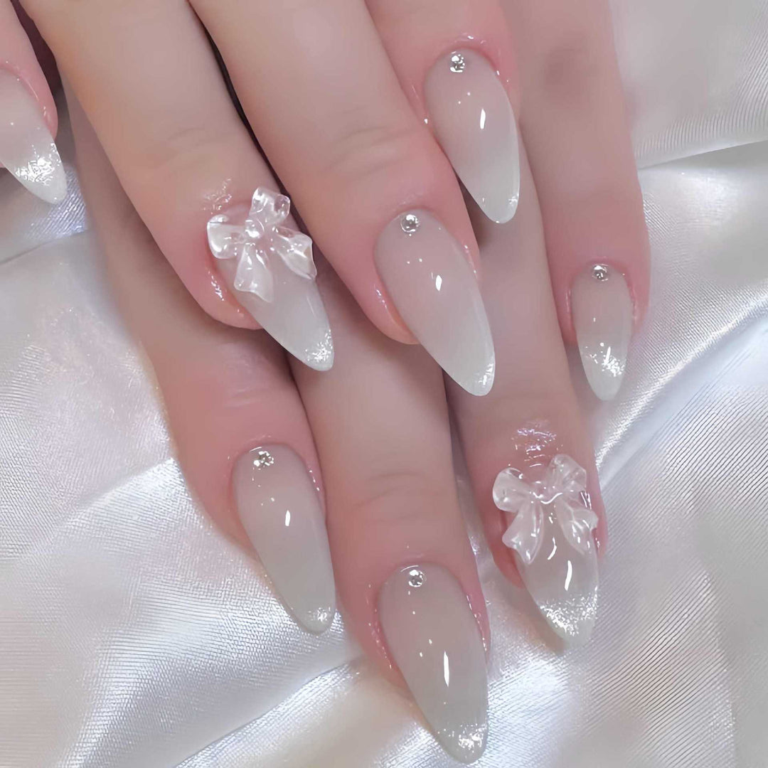Elegant Stiletto-Shaped Press-On Nails with Decorative Bow Accents Stornfield