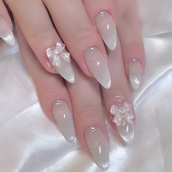 Elegant Stiletto-Shaped Press-On Nails with Decorative Bow Accents Stornfield