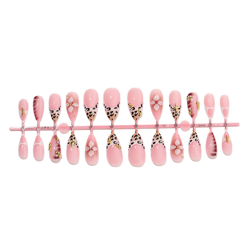 Acrylic nail set with glamorous accents and floral decorations Stornfield