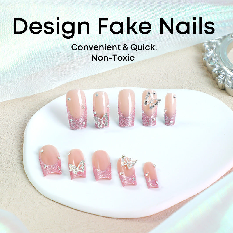 Acrylic nail set with sparkling glitter accents and elegant butterfly motifs Stornfield