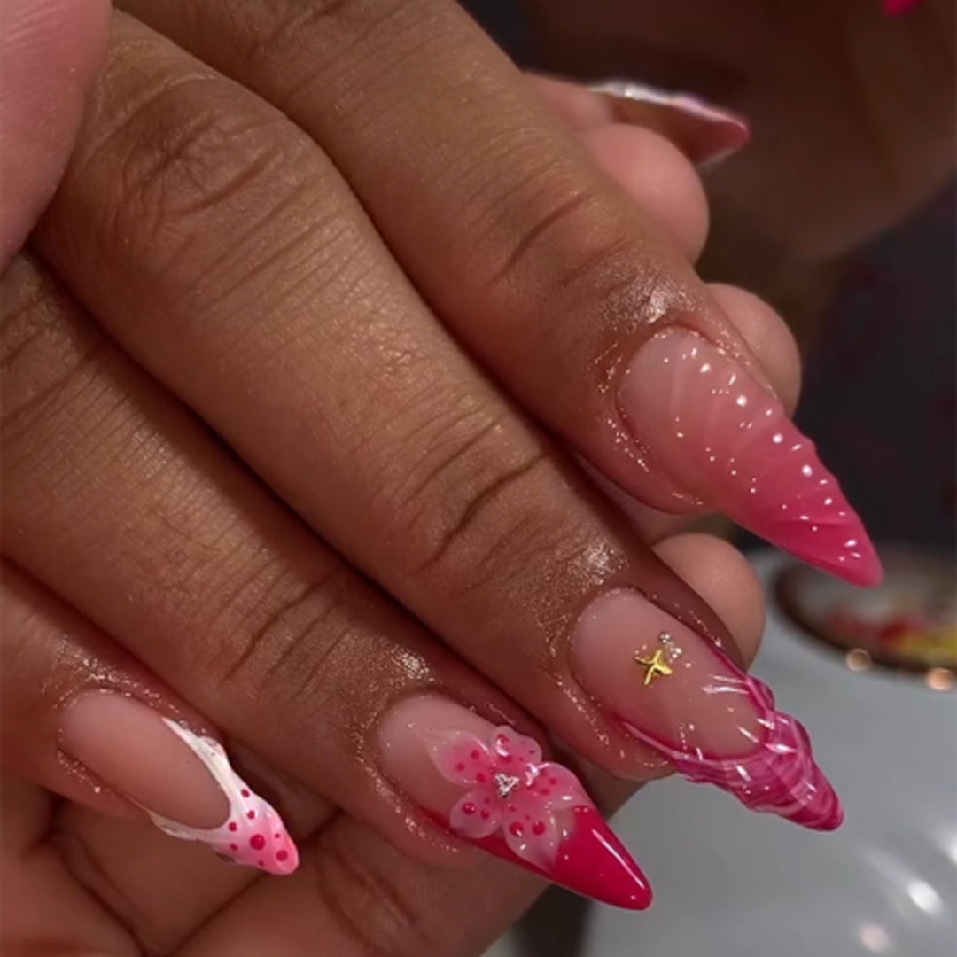 Artful stiletto nails with floral design and glitter accents Stornfield