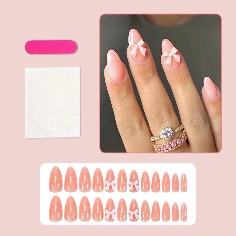 Artificial nail set with delicate bow embellishments Stornfield