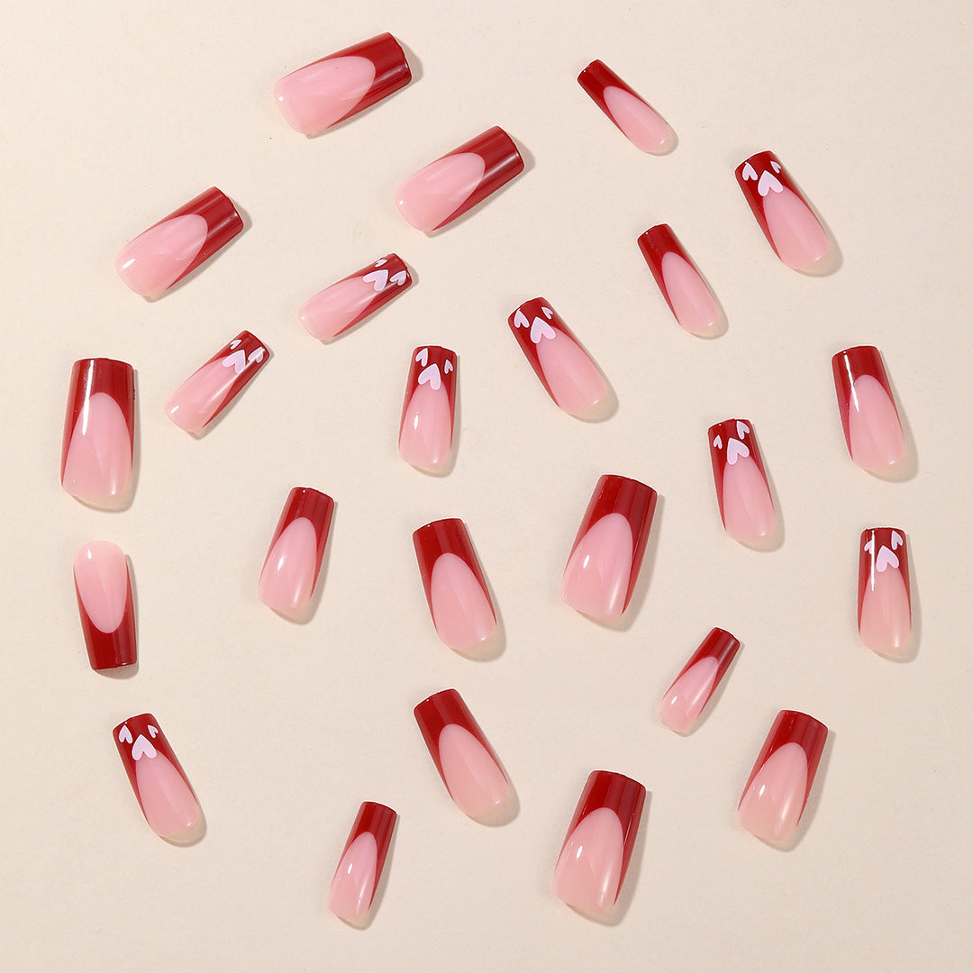 Heart-Patterned Acrylic Nail Art Extensions Stornfield