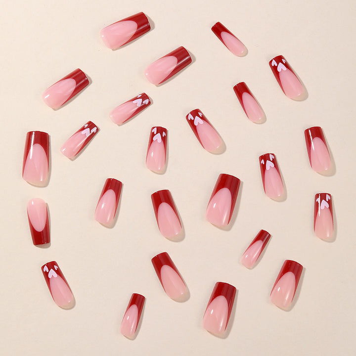 Heart-Patterned Acrylic Nail Art Extensions Stornfield