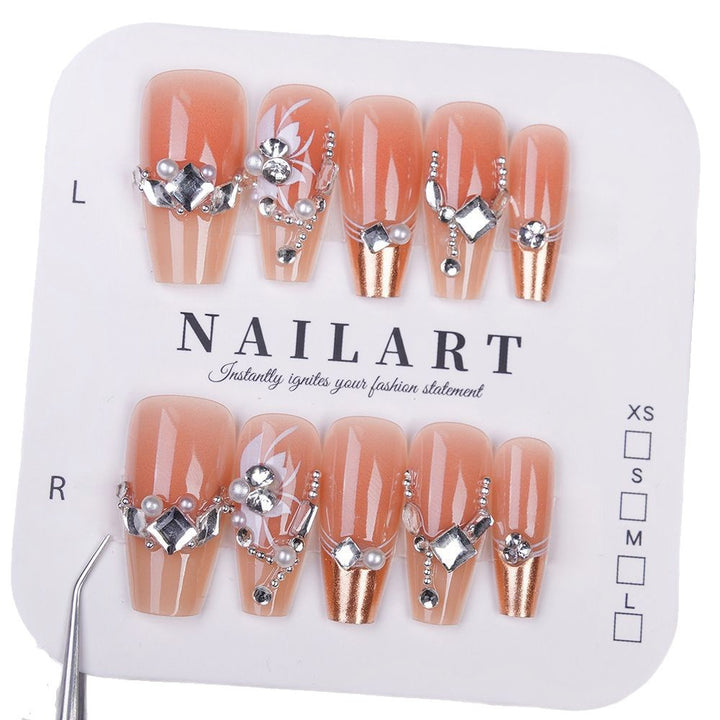 Elegant Press-On Nail Art with Floral and Gemstone Details Stornfield