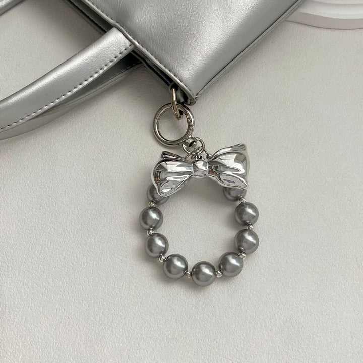 Elegant Pearl Bow Keychain Stornfield