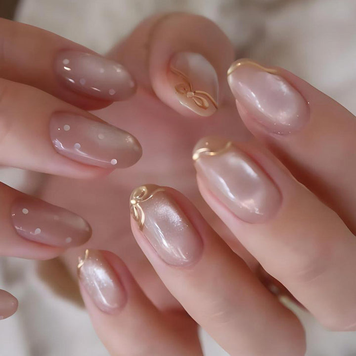 Artificial nail set with shimmering accents and elegant gold embellishments Stornfield
