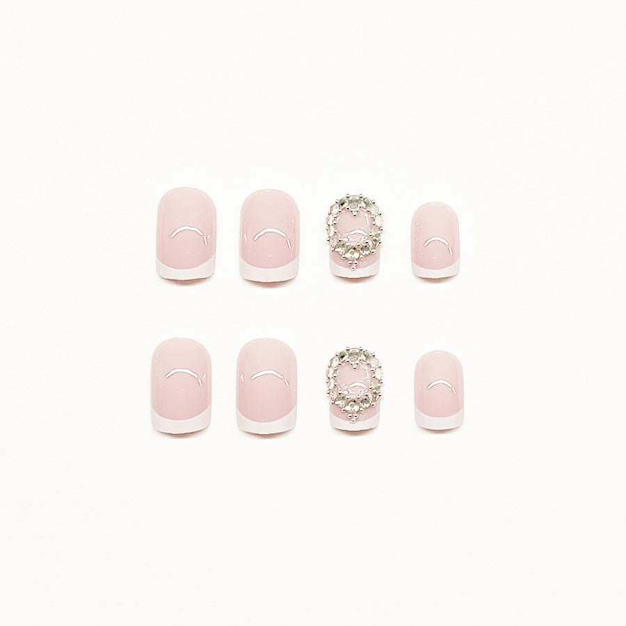 Artificial nail set with elegant French design and rhinestone embellishments Stornfield
