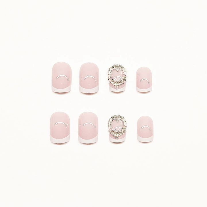 Artificial nail set with elegant French design and rhinestone embellishments Stornfield