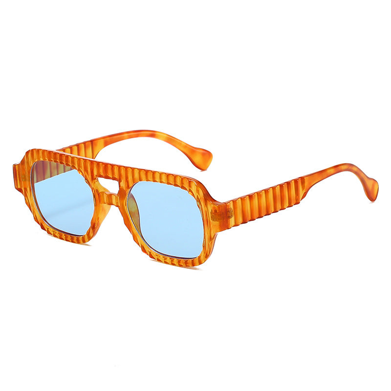 Ladies fashionable sunglasses in futuristic design with textured frame Stornfield