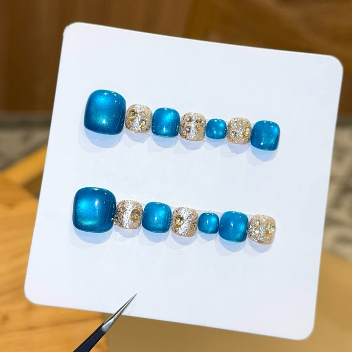 Art Nail Design with Shimmering Accents and Sparkling Rhinestone Details Stornfield