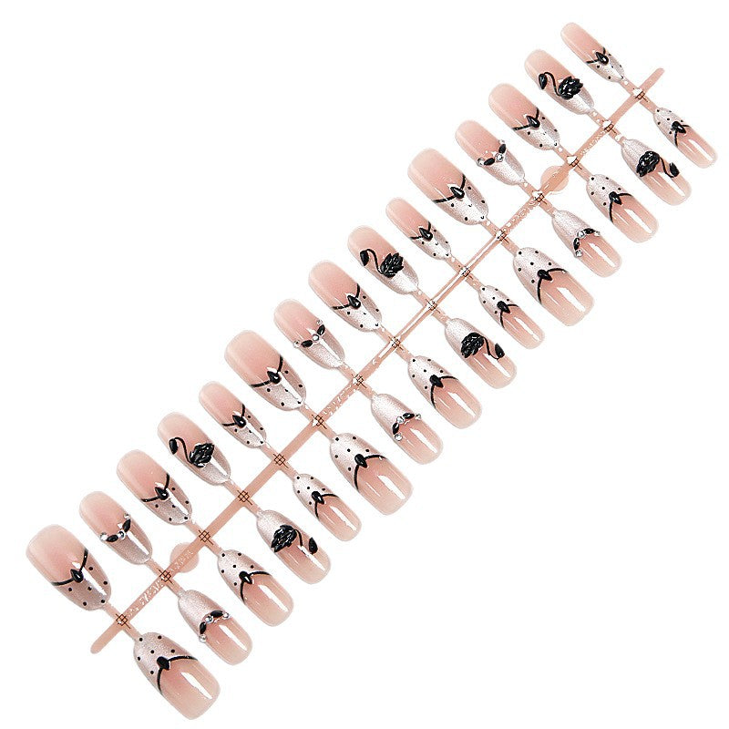 Artificial nails with floral accents and elegant shine Stornfield