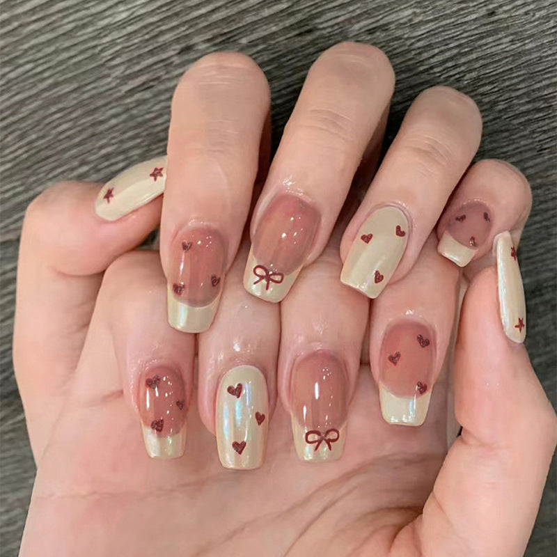 Artifical nails with romantic heart and ribbon designs Stornfield