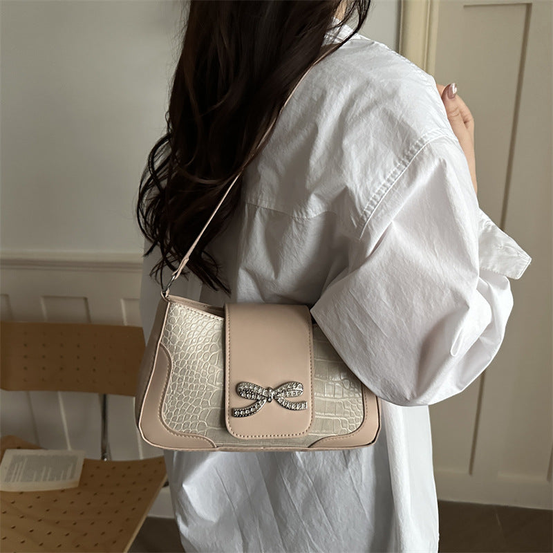 Elegant Crocodile-Patterned Handbag with Bow Detail