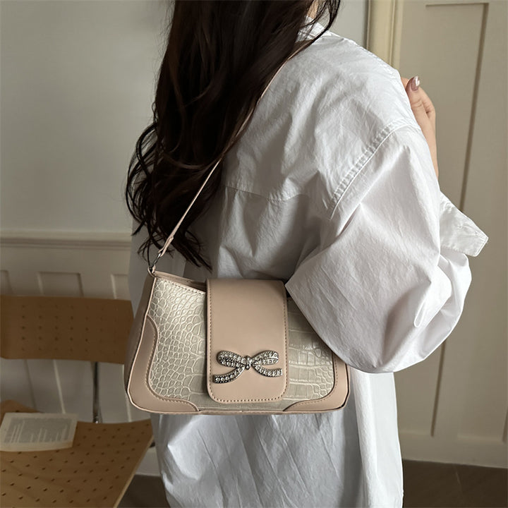 Elegant Crocodile-Patterned Handbag with Bow Detail