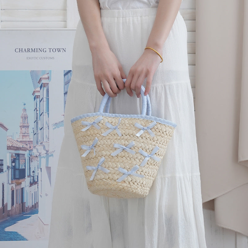 Basket bag with delicate bows and padded edge Stornfield