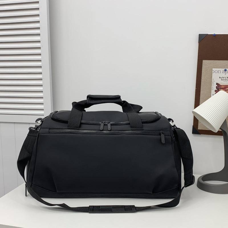 Sporty travel bag with reinforced carrying handles and multiple compartments Stornfield