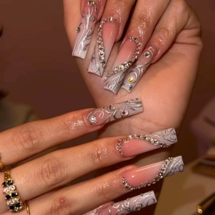 Artificial nails with elegant 3D pattern and radiant rhinestone decorations Stornfield