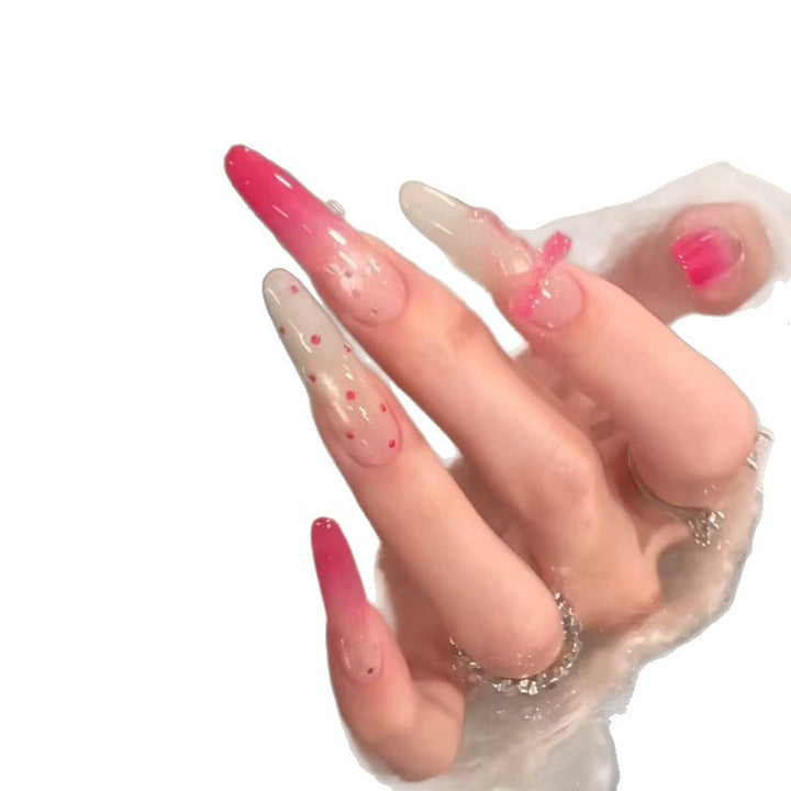 Artistic Gradient Nail Extensions with Decorative Accents