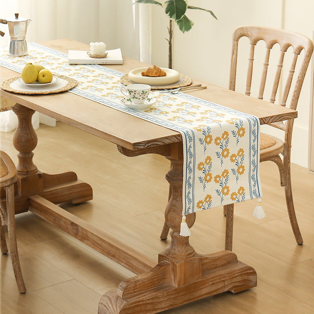decorative table runner made of woven cotton with tassels Stornfield