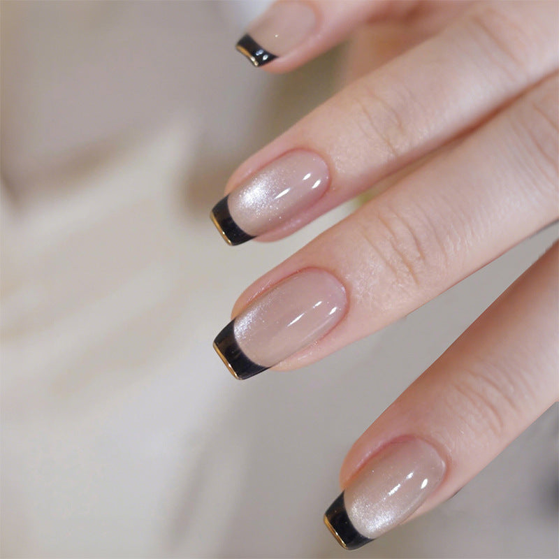 Acrylic nail set with elegant French design and glitter accents Stornfield