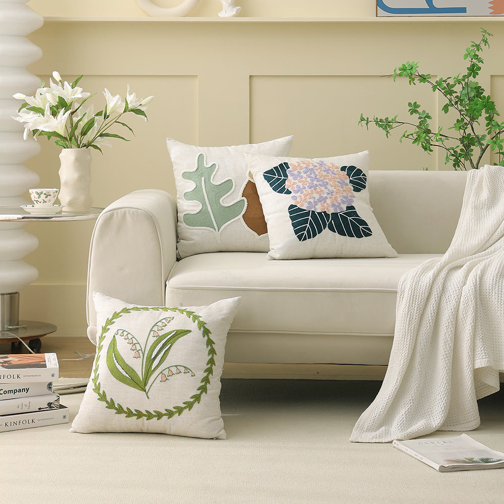 Square bouclé decorative cushion with tufted flower appliqué