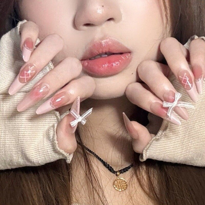 Artificial nails with elegant playful design