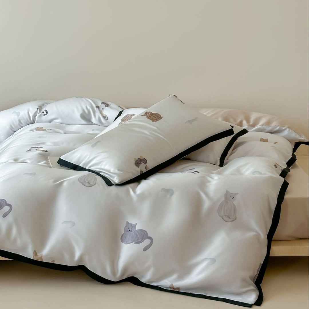 Silk-gloss satin bedding set with minimalist cat illustrations and fine piping
