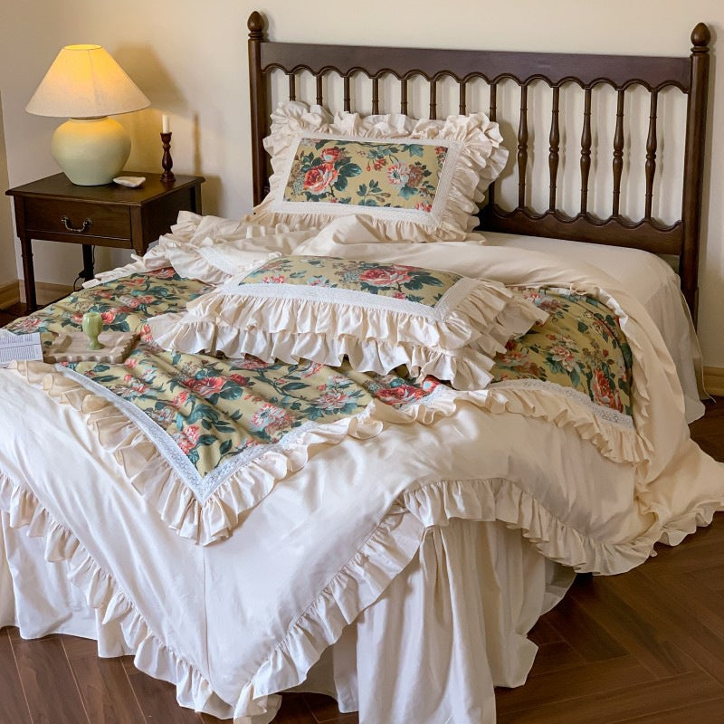 Romantic bedding set with ruffles, floral inserts and decorative pillowcase