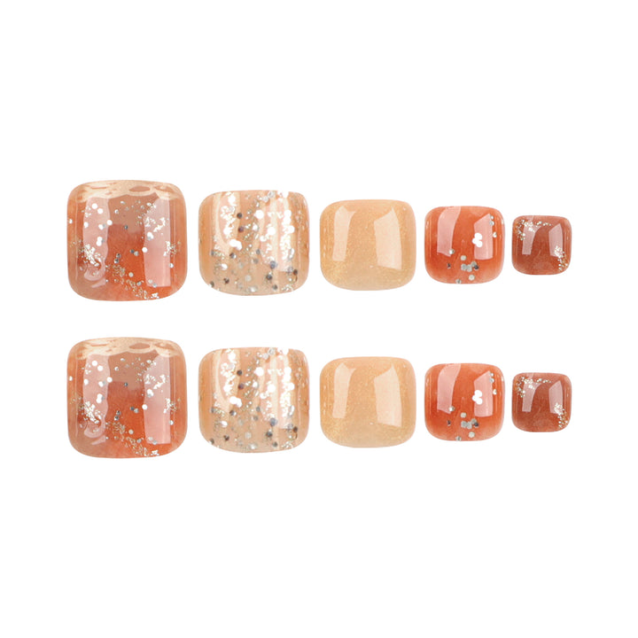 Artistic toenail design with glitter and golden accents Stornfield