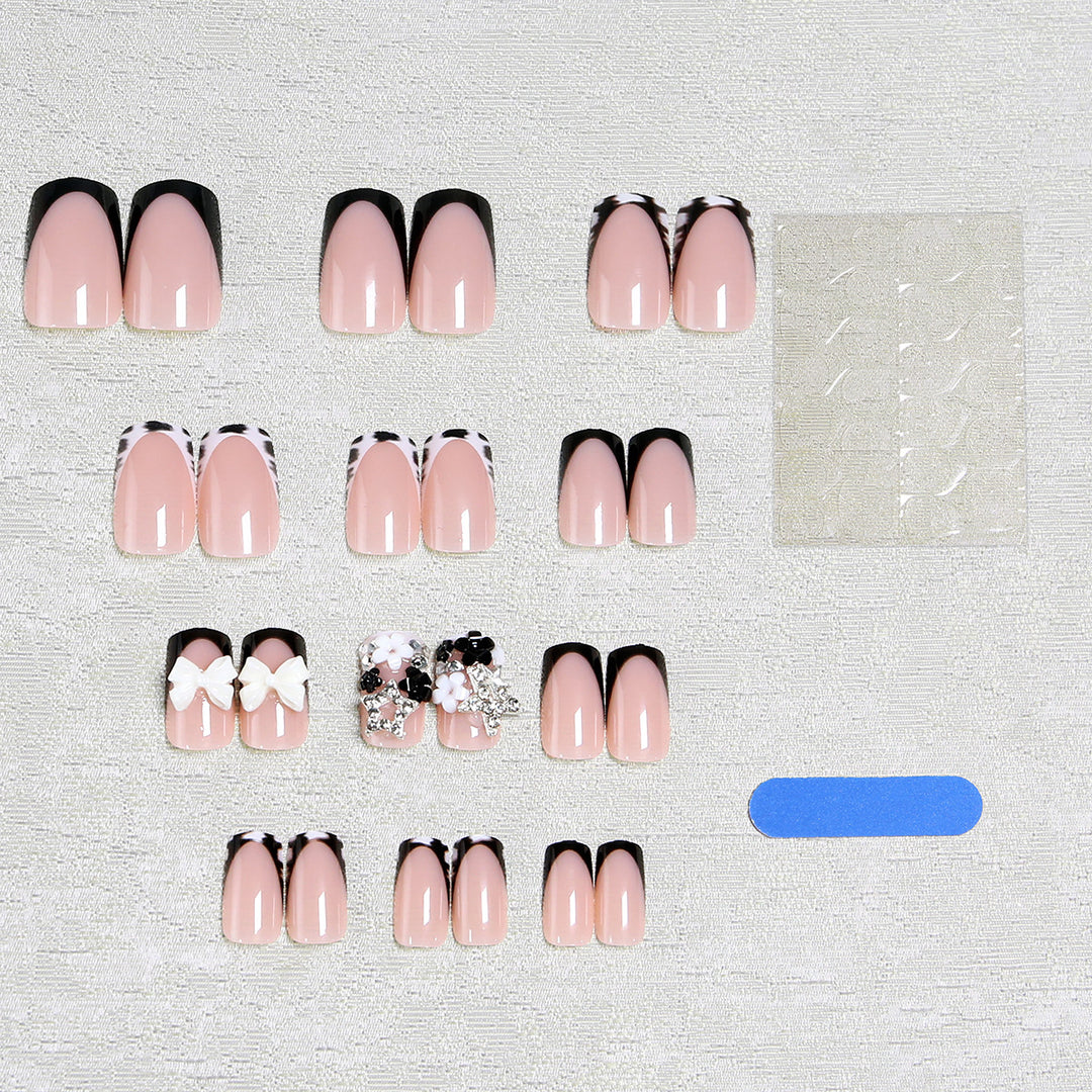 Artificial nail design with elaborate 3D decorations Stornfield