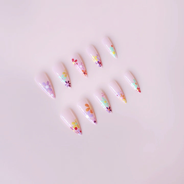 Acrylic nail set with vibrant floral designs and sharp accents Stornfield