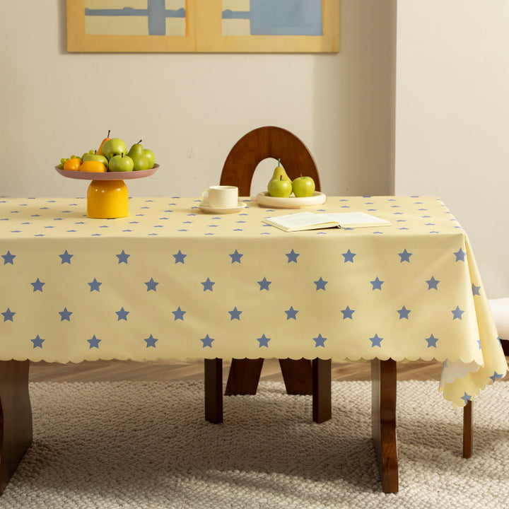 Wipeable tablecloth with star pattern and wavy hem Stornfield