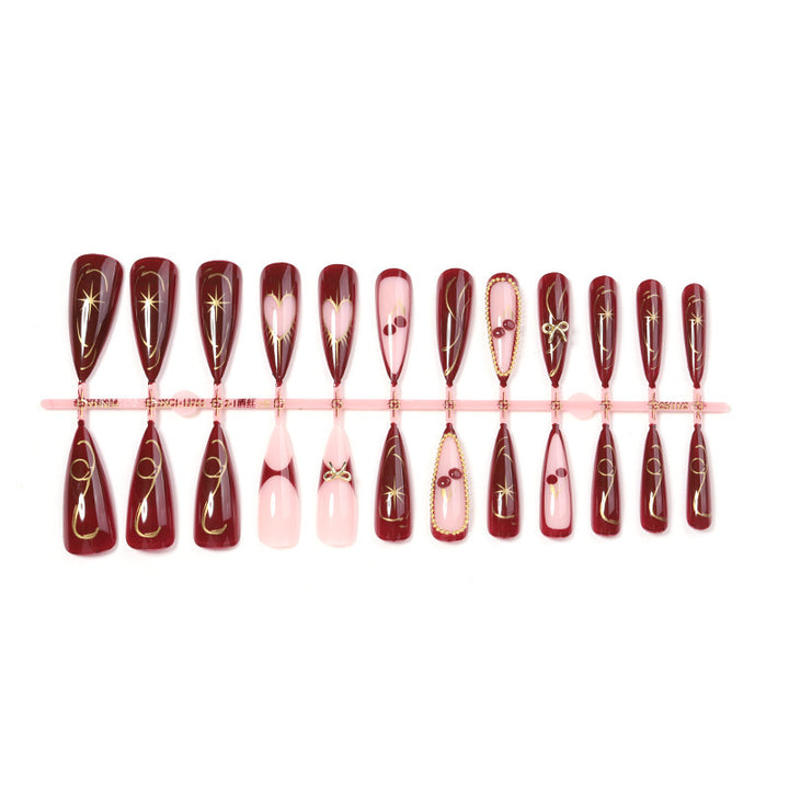 Artificial nail set with luxurious golden accents and glamorous design Stornfield