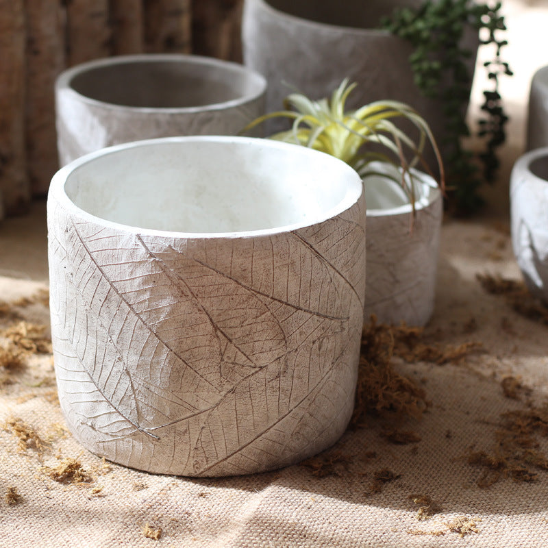 Decorative plant container made of handmade ceramic with leaf pattern Stornfield