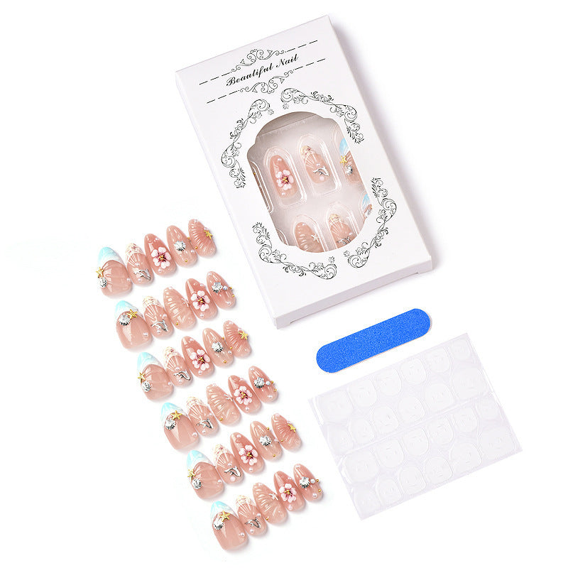 Acrylic nail set with filigree shell and flower decorations Stornfield
