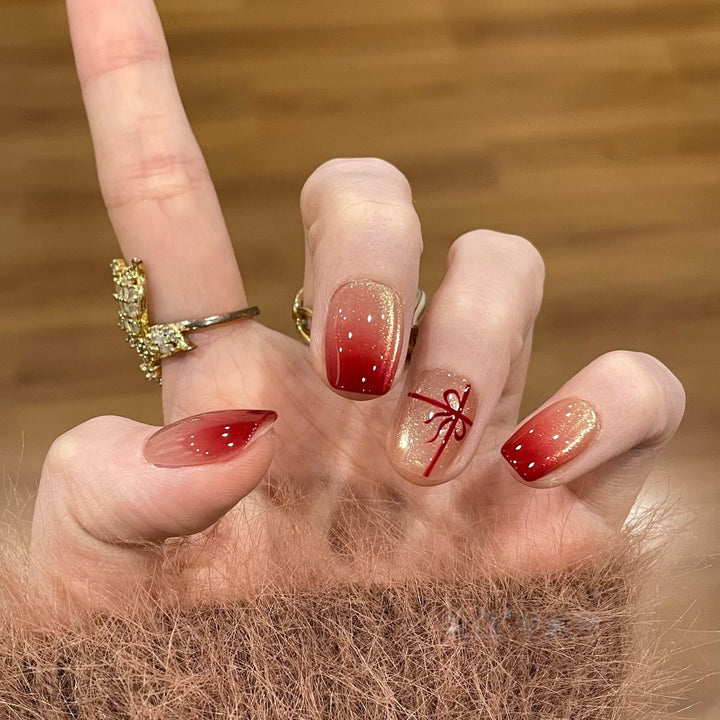 Artificial nails with festive gradient color and elegant decorations Stornfield